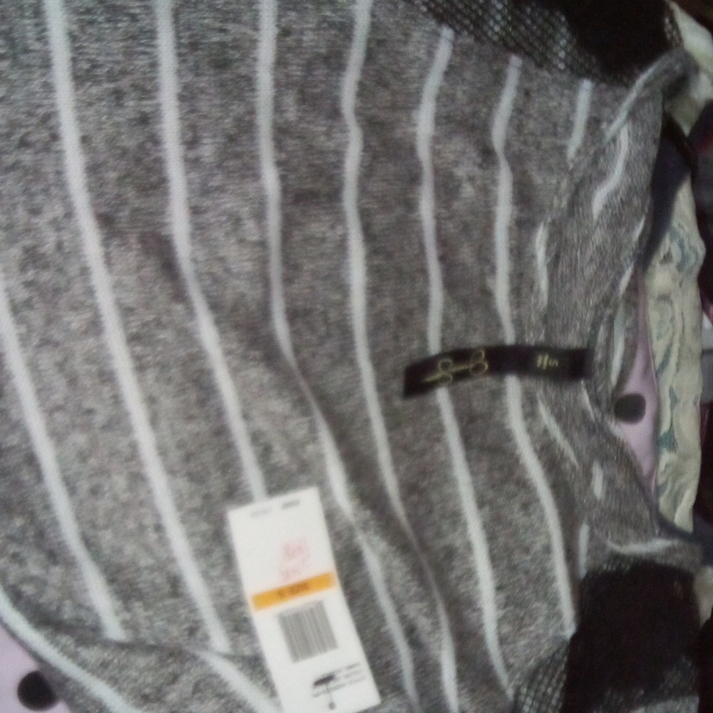 Small grey white and black sweater style shirt